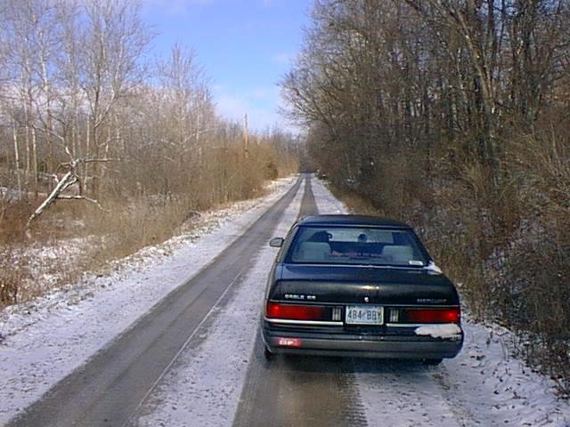 Looking north up Co. Rd 525 W.  My car Schwarzwiesel poses with my wife and 10
month-old son inside keeping warm.