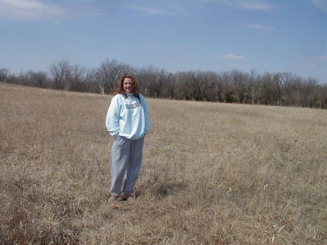 Laura stands where the lines meet