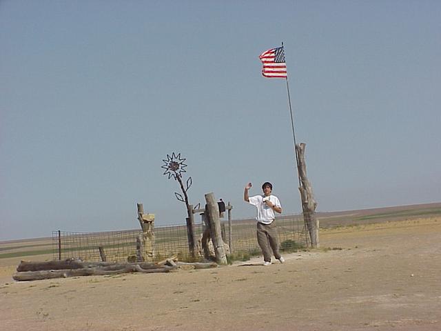 Joseph Kerski at Mount Sunflower, highest point in Kansas, approximately three miles northwest of confluence.