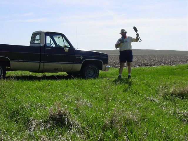 Working on the tire about 2 miles east.