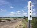 #9: State line sign on railroad track about 2000 meters northwest of the confluence.