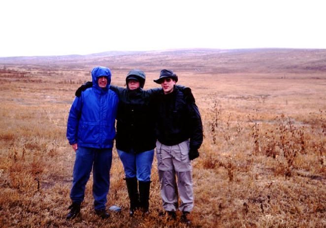 Looking east.  Ben, Reb, and Dan (left to right) are standing on the confluence