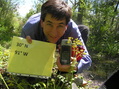 #3: Joseph Kerski crouching in the swamp at the confluence site.