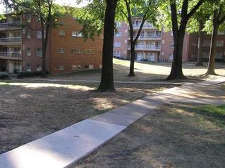 #1: The confluence of 39 North 77 West lies just to the left of the large tree in the center of the photograph, inside the apartment building.