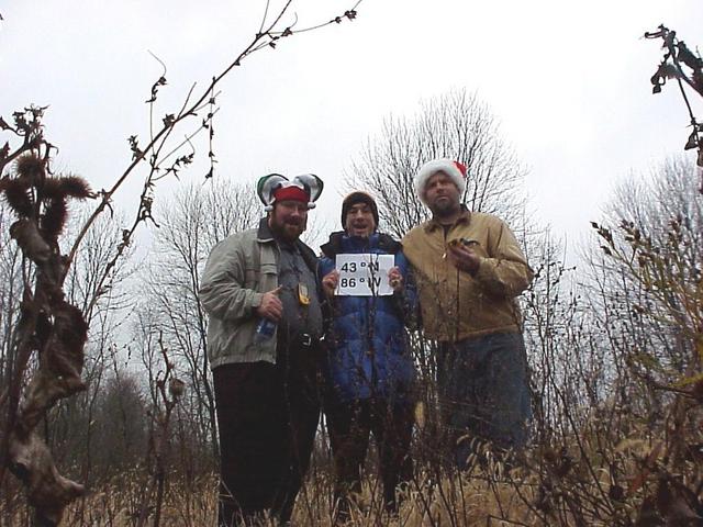 Brian Lehmkuhle, Joseph Kerski, and Michael Lehmkuhle don festive hats to mark their arrival 43 N 86 W.