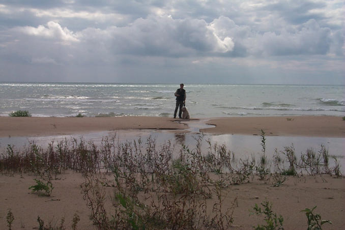 Alan and Max standing on the 85th line of longitude.  The confluence is approximately 420 meters behind them.