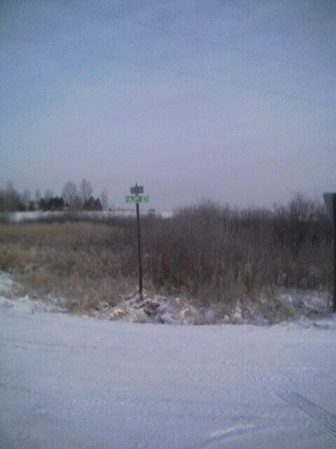 Road intersection 180 m south of confluence