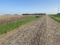 #9: Nearest road to the confluence point. The confluence lies in the left field in the distance.