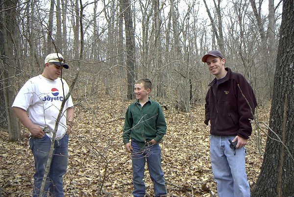 Two kids (our guides) and Jon at the confluence