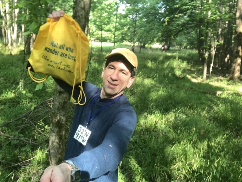 Joseph Kerski at the confluence point with Not All Who Wander Are Lost bag. 