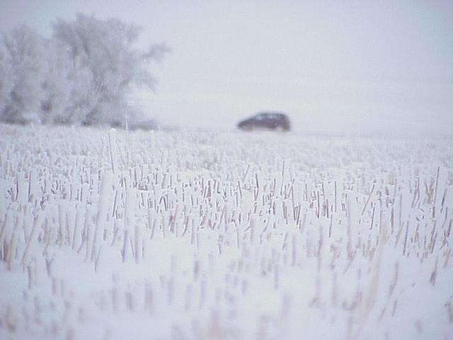 The vehicle is in sight after the snowy confluence trek.