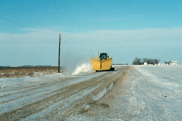 Snowplow clearing the road where we parked