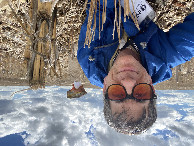 #10: Joseph Kerski lying in field at confluence point. 