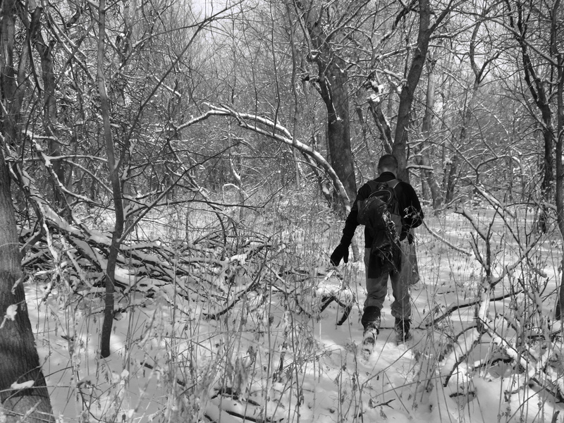 Russ hiking through the woods