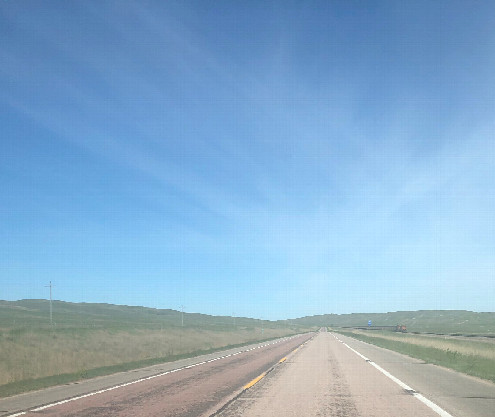 #1: Huge sky headed west on N-2, with a miles long coal train headed towards us on the right