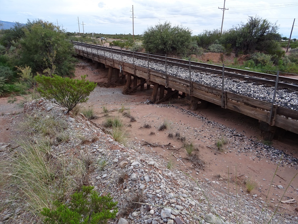 Railway bridge spanning the arroyo and Riata road in the background