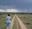 #2: Chuck walking on the road that shouldn't be traversed by a Honda Civic.