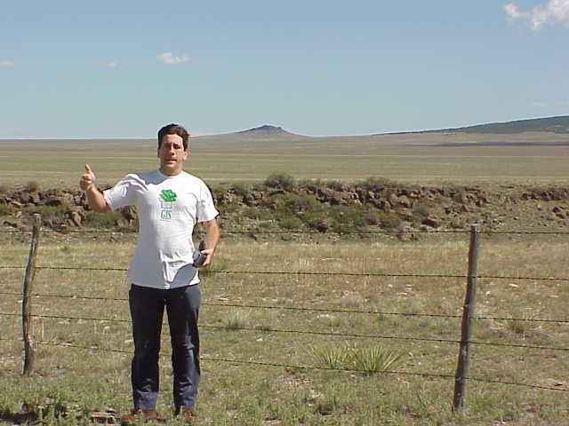 Joseph Kerski with the confluence behind him.