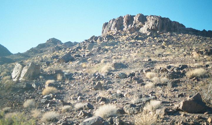 Confluence lies at base of right side of vertical rock formation.