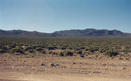 #6: Looking southeast from the road at the point with the Toquima Range in the background.  The pink spot in the middle of the picture is the pin flag marking the point.