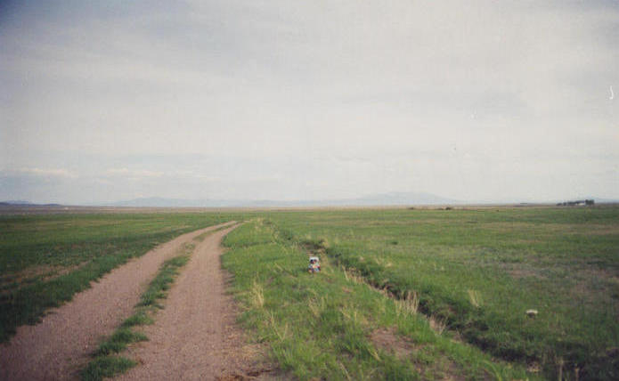 T. McGee Bear facing north at the point.  Valley Mountain and Lone Butte are in the background.