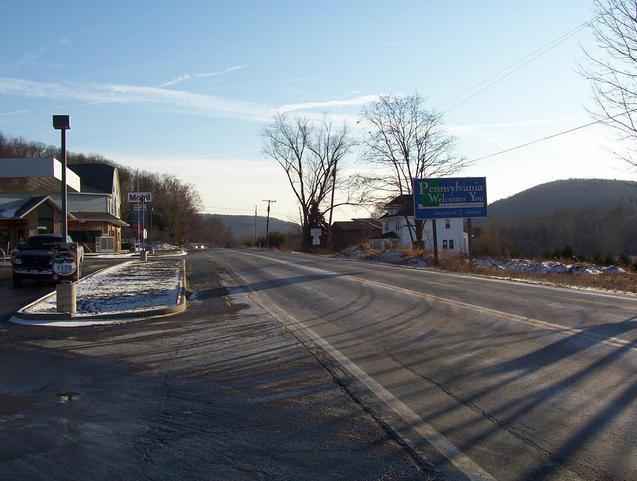 Pennsylvania welcome sign and gas station just south of NY/PA state line