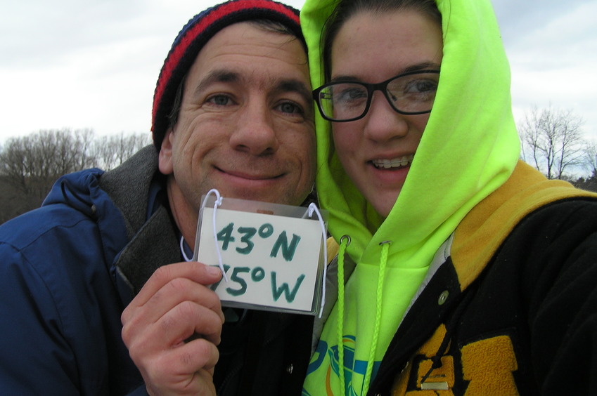 Joseph Kerski and Lilia Kerski standing in the snow and ice at the confluence.