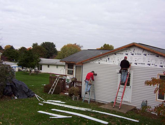 House to the north of the confluence receiving new siding.