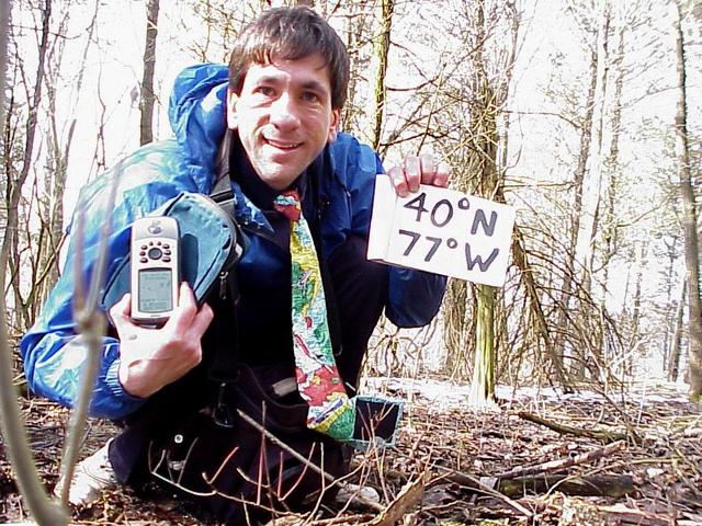 Geographer Joseph Kerski at the confluence site wearing geographic tie.