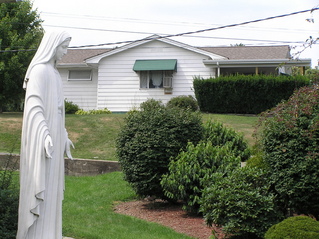 #1: The confluence of 40 North 80 West is adjacent to Mary's left elbow, on the south-facing lawn, looking north-northwest.