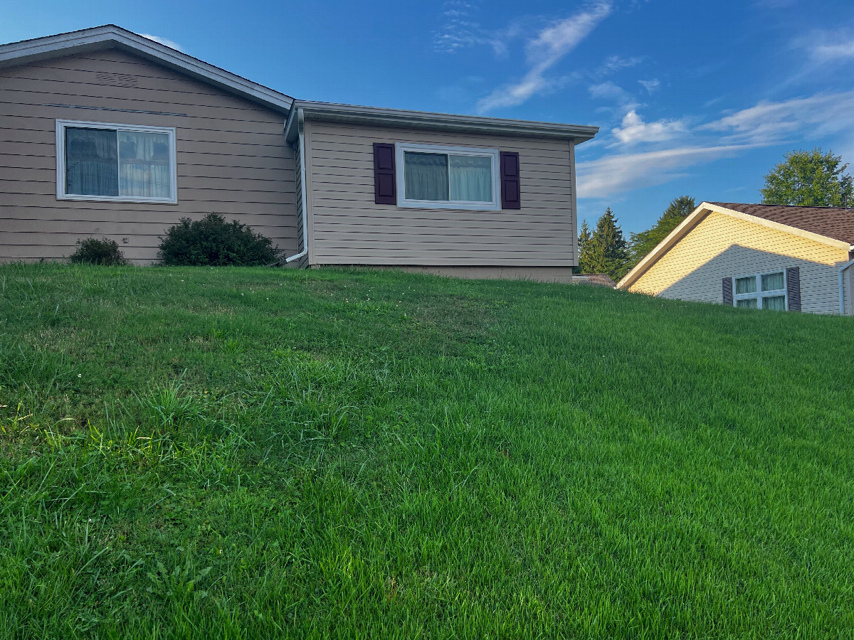 The confluence point lies on this house’s lawn.  (This is also a view to the North)