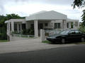 #7: Confluence and old car are behind this house