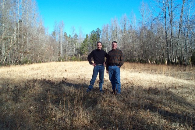 Confluence hunters stand atop their quarry: 35N 81W