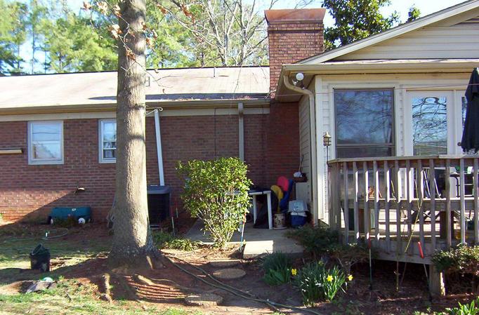 The confluence is very near the corner of the back porch.