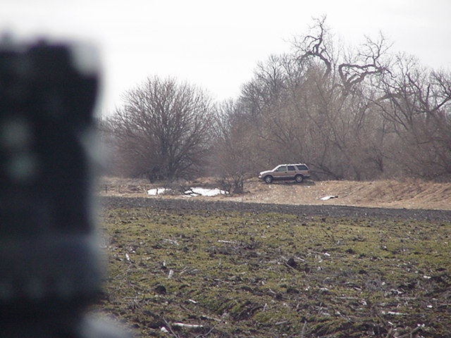 At Site-Looking South-Zoomed to Vehicle  & Patch of Snow.