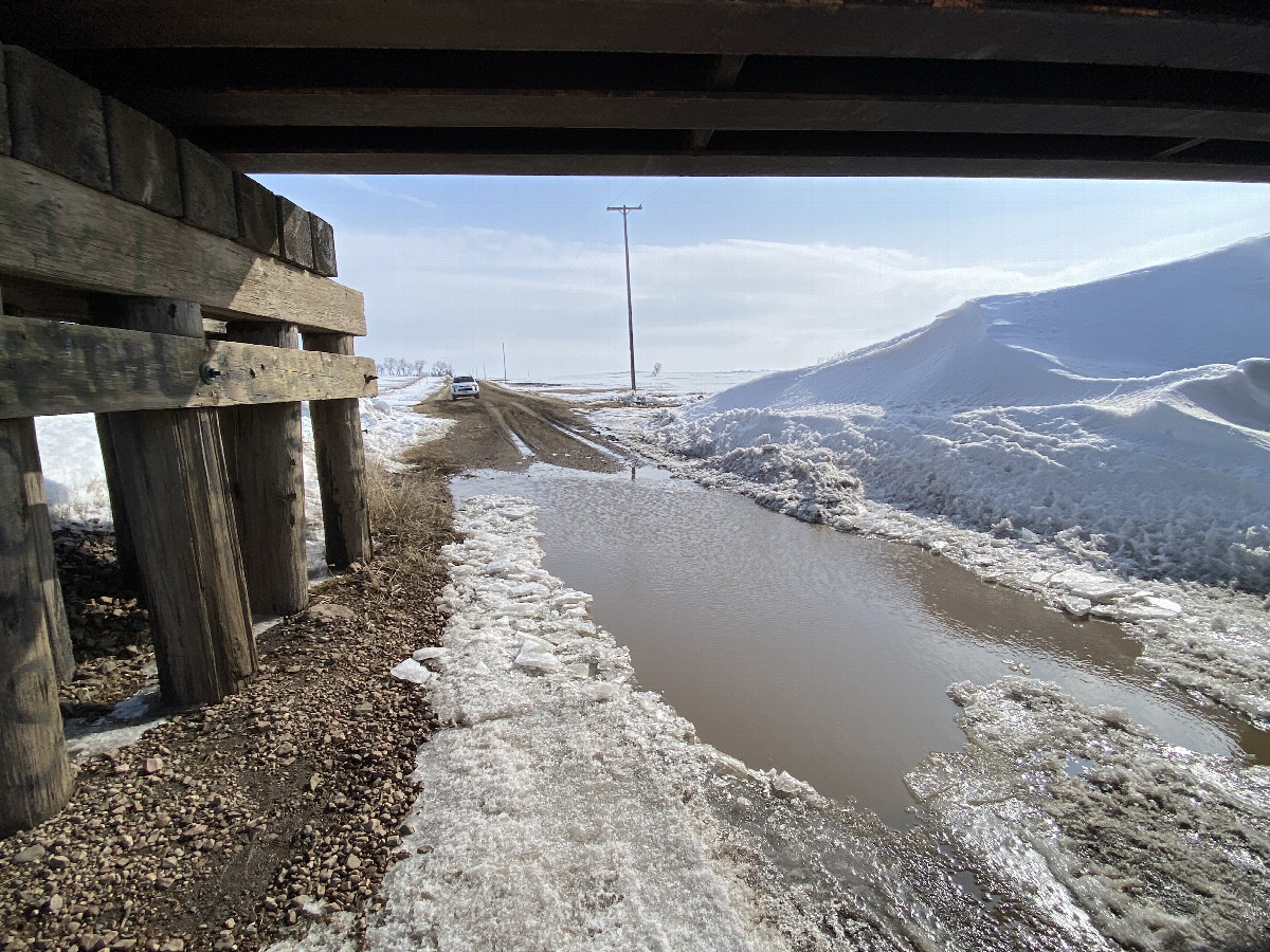 Nearest road to the confluence point with melt water from snow.