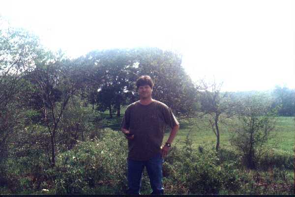 Me at the confluence with my precious Garmin.