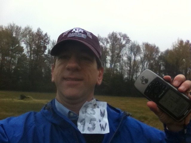 Joseph Kerski in the rain at the confluence.