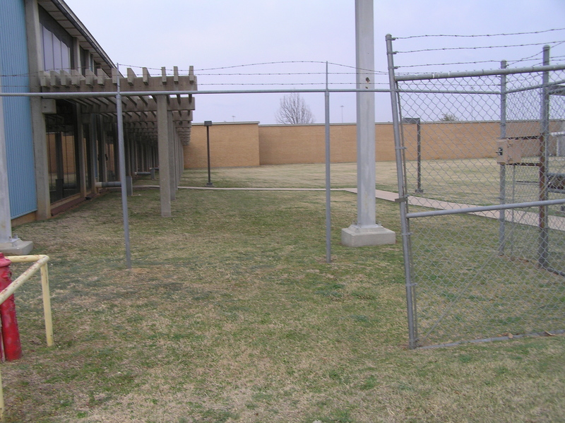 Site of 33 North 97 West, looking east.  The confluence is 1 meter beyond the large cement pole in the background right center.