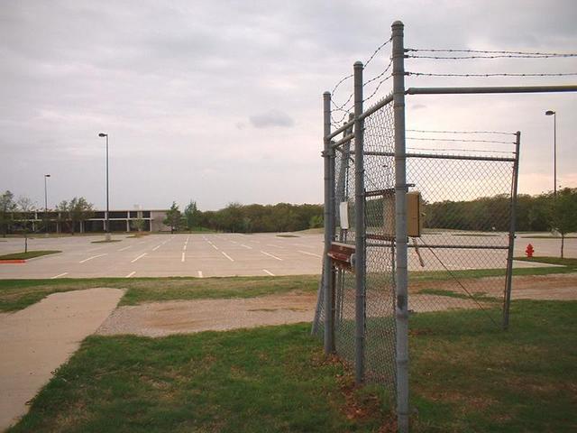 A parking lot behind the building as seen from the confluence.