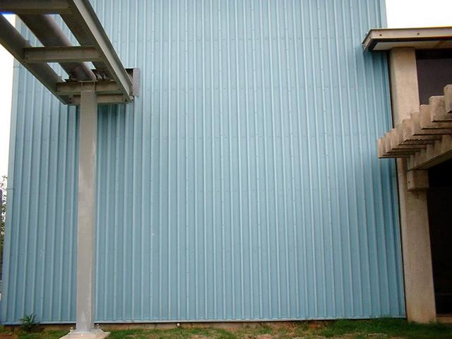 A large blue wall, as seen from the confluence.