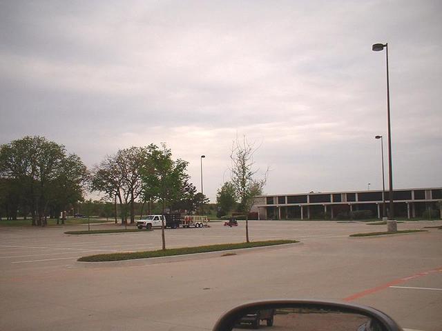 A landscaping crew maintaining Convergence Plaza, and, unknowingly, 33N 97W.