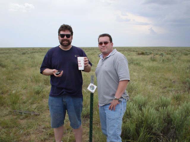 From left:  fencepost driver, Garmin, Todd, ranch cup, confluence marker, & Steve