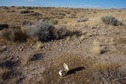 #5: The confluence point lies in desert terrain near the eastern shore of Sevier (Dry) Lake.  A piece of broken electronic equipment marks the point.