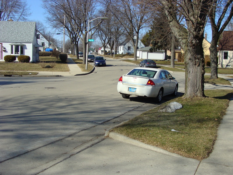 Looking north up Buchanan Pl from 43N 88W (plaque is to left of corner across the street, next to a little pile of snow)