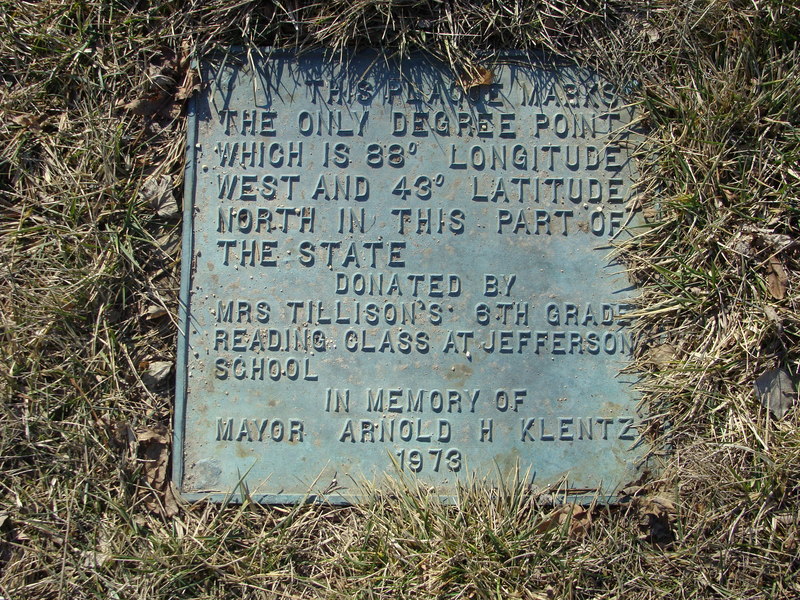 The local ground cover needs to be trimmed from the plaque.