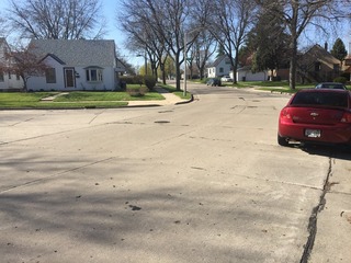 #1: Site of 43 North 88 West, in the foreground, looking north northwest to the marker on the opposite curb.