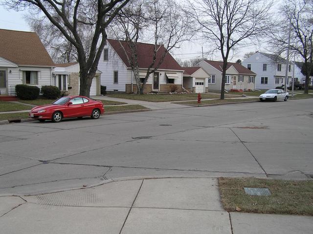 Confluence of 43 North, 88 West looking southeast.  In the lower right foreground is the confluence plaque, and 1 meter to the right of the red fire hydrant in the middle center lies the confluence.