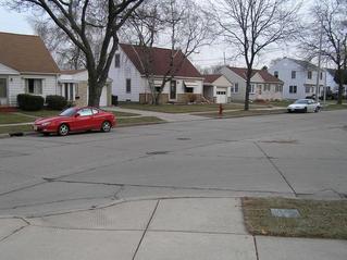 #1: Confluence of 43 North, 88 West looking southeast.  In the lower right foreground is the confluence plaque, and 1 meter to the right of the red fire hydrant in the middle center lies the confluence.