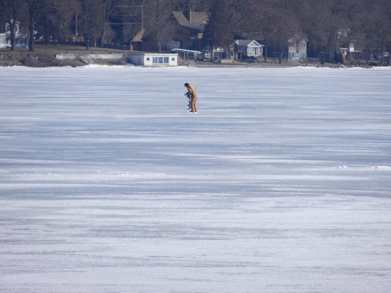 Drilling a new hole on frozen Lake Ripley